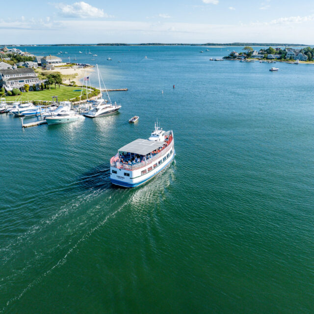 An aerial view of a group of boats in a body of water.