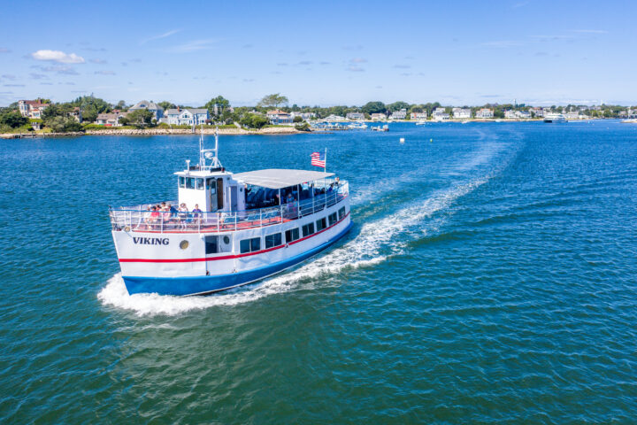 vessel painted red, white and blue plying through water